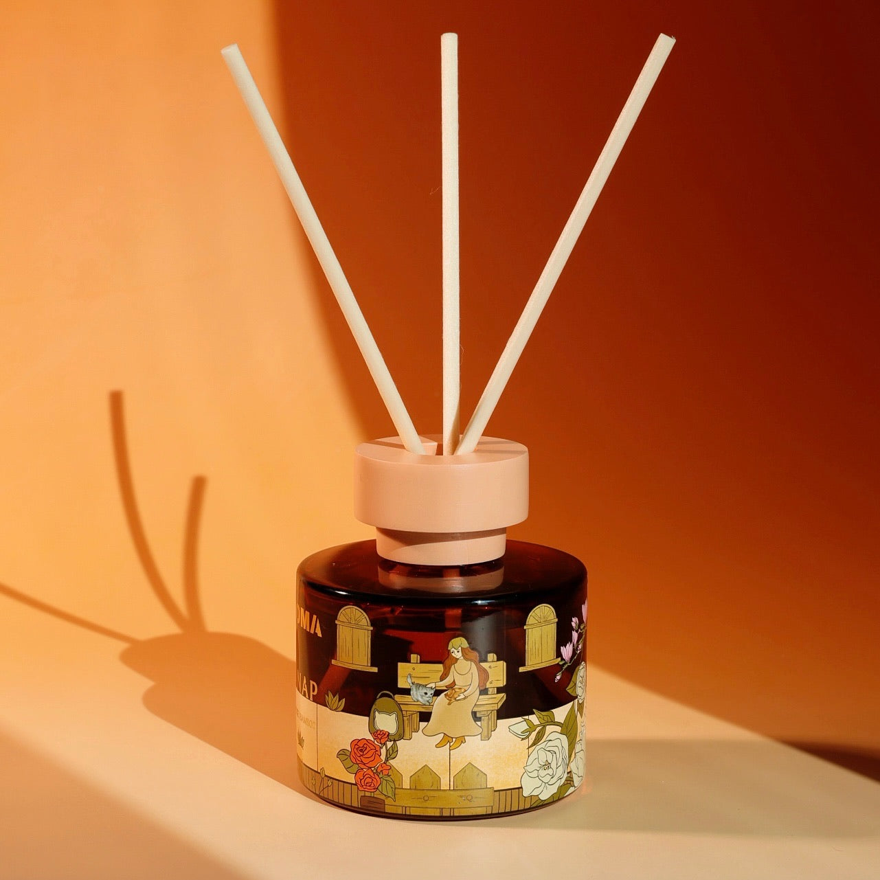 Close-up of the original hand-drawn artwork on a FUROMA reed diffuser bottle